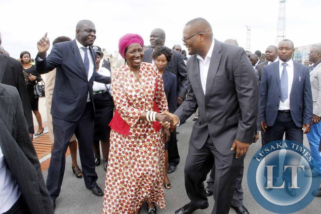 Acting President Inonge Wina greets Emmanuel Mwamba after seeing- off President Lungu at Kenneth Kaunda International Airport who left for Addis Ababa, Ethiopia for the African Union Summit on January 29,2015 -Picture by THOMAS NSAMA