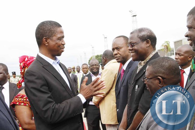 President Edgar Lungu greets his Special Assistant for Political Affairs Kaiza Zulu on arrival at Kenneth Kaunda International Airport shortly before departure to Addis Ababa, Ethiopia for the African Union Summit on January 29,2015 -Picture by THOMAS NSAMA