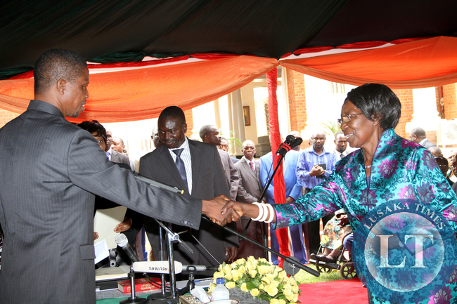 President Edgar Chagwa Lungu congratulates newly apponted Vice-President Inonge Wina during the Swearing-in-Ceremony at State House on January 26,2015 -Picture by THOMAS NSAMA