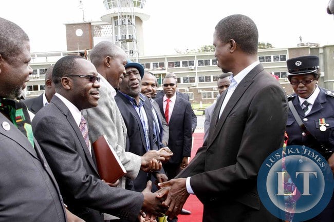 President Edgar Lungu greets his Special Assistant for Political Affairs Kaiza Zulu on arrival at Kenneth Kaunda International Airport shortly before departure to Addis Ababa, Ethiopia for the African Union Summit on January 29,2015 -Picture by THOMAS NSAMA