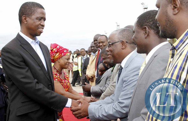 President Edgar Lungu greets Southern Province minister Nathaniel Mubukwanu on arrival at Kenneth Kaunda International Airport shortly before departure to Addis Ababa, Ethiopia for the African Union Summit on January 29,2015 -Picture by THOMAS NSAMA
