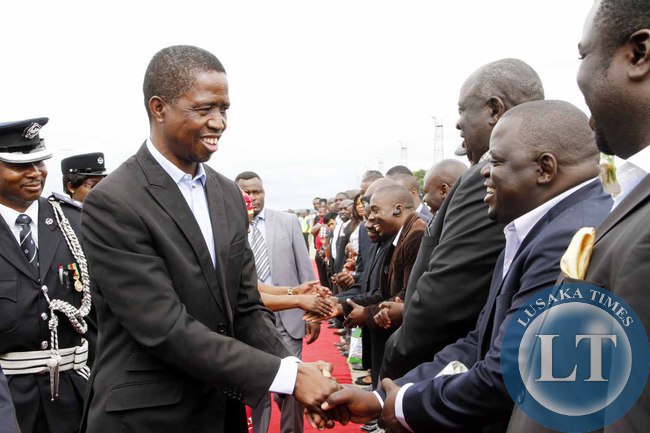 President Edgar Lungu greets PF officials on arrival at Kenneth Kaunda International Airport shortly before departure to Addis Ababa, Ethiopia for the African Union Summit on January 29,2015 -Picture by THOMAS NSAMA