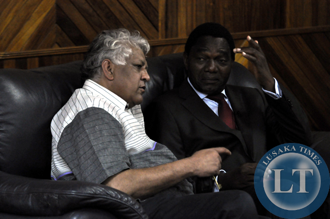 FILE: UPND campaign manager Depak Patel confers with party president Hakainde Hichilema