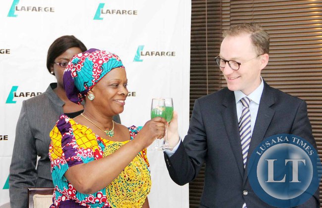First Lady Esther Lungu toasts with Lafarge Zambia Chief Executive officer Emmanuel Rigaux (r) during the Launch of the Lafarge Foundation at Twangale Park in Chilanga, Lusaka on February 19,2015 -Picture by THOMAS NSAMA