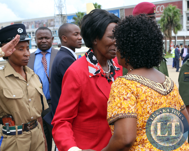 First Lady Mrs Ester Lungu greets Vice president Mrs Inonge Wina at KK internatioanal airport she accompanied her Husdand President Lungu/Picture by EDDIE MWANALEZA/STATEHOUSE.