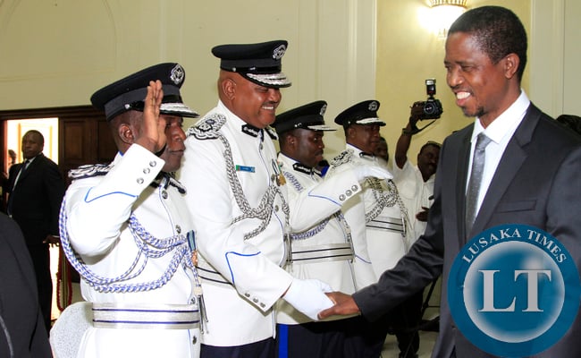 President Edgar Lungu greets the Swearing in Ceremony looking on is Mr Auxensio Daka Comissioner of Police Muchinga Province,and Mr Stanslous Agrippa Mukuka Chewe as Commissioner of Police Northern Province at Statehouse on Thursday 19-02-2015 PICTURE