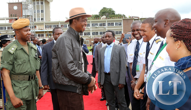 President Edgah Lungu share alight moment with pilots at KK internatioanl airport in Lusaka Before he left for working Holiday in Mfuwe on 04-01-2015 PICTURE BY EDDIE MWANALEZA/STATEHOUSE.
