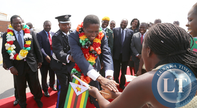 President Edgar Lungu with Zimbabwean vice President Minister Emmerson Mnangagwa at Harare internatioanl airport thanks dancers on arrivial in Zimbabwe. Picture By EDDIE MWANALEZA /STATEHOUSE