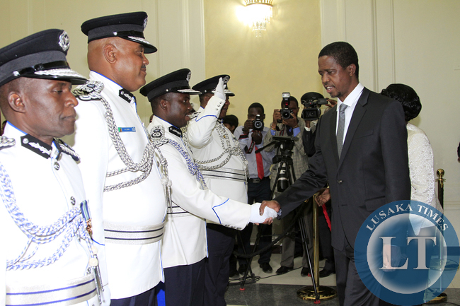 President Edgar Lungu greets Mr Hudson Namachila Comissioner Of Police Eastern Province the Swearing in Ceremony looking on is Mr Auxensio Daka Comissioner of Police Muchinga Province,and Mr Stanslous Agrippa Mukuka Chewe as Commissioner of Police Northe