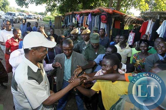 President Edgar Chagwa Lungu (left) greets people at Kakumbi Shopping Centrer in Mfuwe on Saturday,February 7,2015.PICTURE BY SALIM HENRY/STATE HOUSE