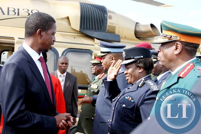 President Lungu talks with Zambia army commander Lt Gen Paul Mihova as ZAF Commander Lt Gen Eric Chimese and Inspector General of Police Stella Libongani and ZNS Commandant Lt Gen Nathan Mulenga shortly before departure at Kenneth Kaunda International Airport for Angola on February 13,2015 -Picture by THOMAS NSAMA