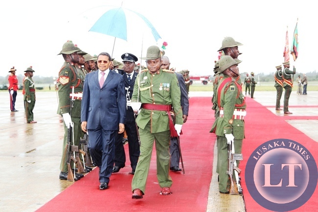 President of Tanzania,Jakaya Kikwete inspecting the guard of honour shortly on upon arrival for a state visit at Kenneth Kaunda International Airport in Lusaka.