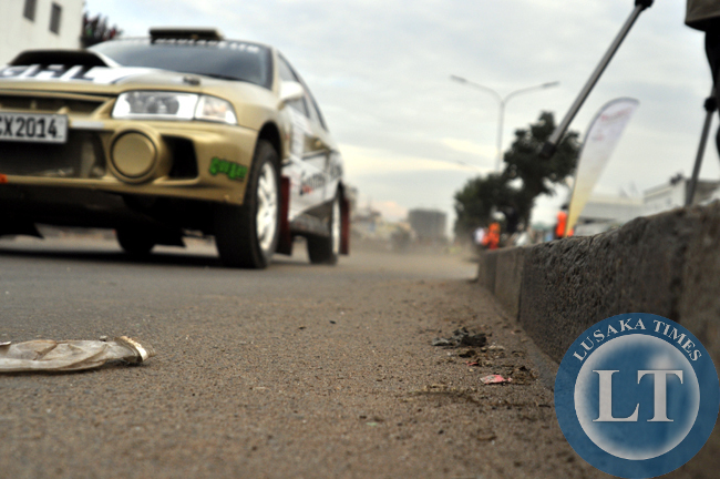 A rally car raves off along Freedom Way during the ZMSA national motor rally.