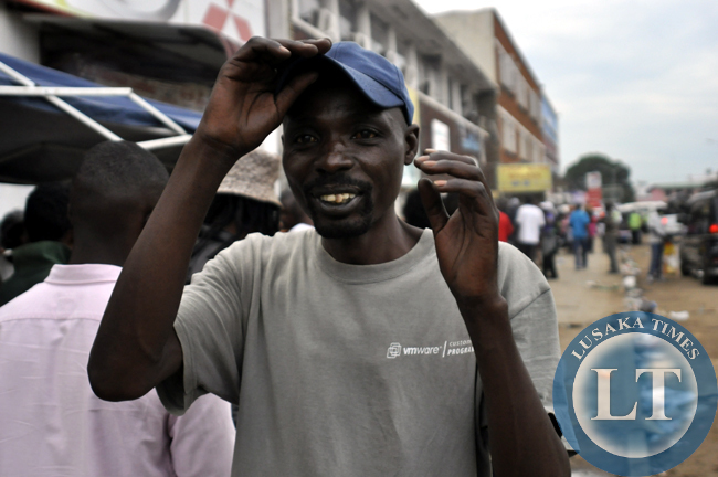 An unideitified rally fan poses for a photo after the ZMSA national rally championship