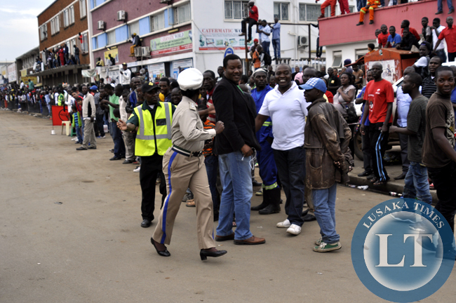An unidentified traffic police officer races along the rally field