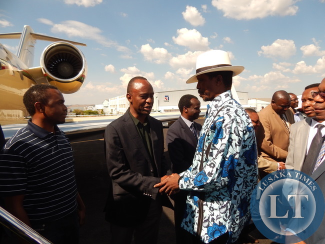 PRESIDENT LUNGU meets State House Deputy Minister, Mulenga Sata, at South Africa's Lanseria International Airport before departure for Lusaka this afternoon (15/03/15)