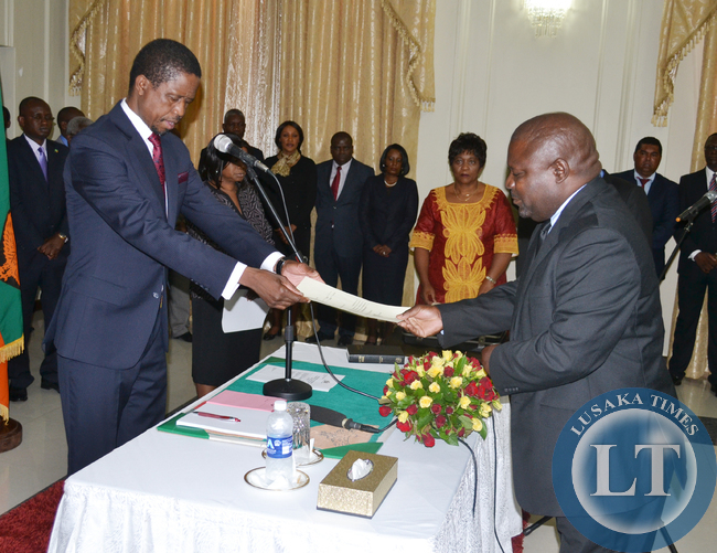 President Edgar Lungu swears in Lucky Mulusa as Special Assistant for Project Monitoring and Implementation at State House in Lusaka on 3 March 2015