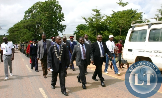 FOREIGN Affairs Minister Harry Kalaba franked by Provincial Minister Benson Kapaya (r) and Mansa Mayor Moonga Silondwa joins the youths in a match past during the youth day celebrations FOREIGN Affairs Minister Harry Kalaba franked by Provincial Minister Benson Kapaya (r) and Mansa Mayor Moonga Silondwa joins the youths in a match past during the youth day celebrations