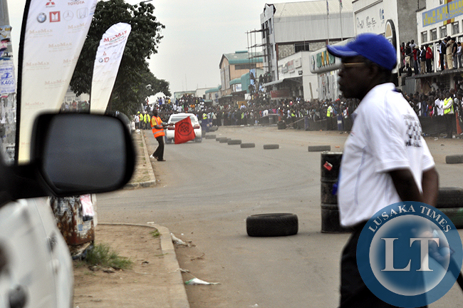 ZMSA vice president Charles Ching'ambu observes a rally car on the race track