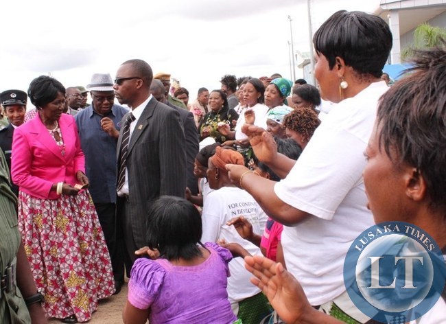 Vice President Inonge Wina (left) greets PF officials (right) at Harry Mwaanga Nkumbula International Airport in Livingstone