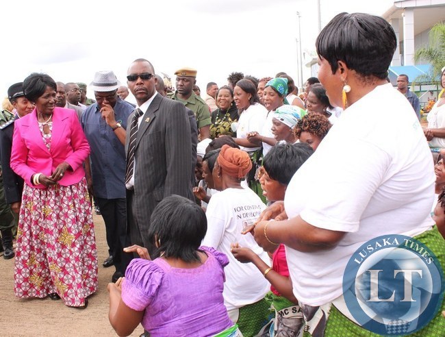 Vice President Inonge Wina (left) greets PF officials (right) at Harry Mwaanga Nkumbula International Airport in Livingstone