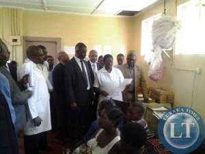 Parliamentary committee on health talking to nurse incharge at mothers shelter at Chipata General Hospital on Thursday as expectant mothers looking