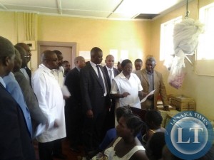 Parliamentary committee on health talking to nurse incharge at mothers shelter at Chipata General Hospital on Thursday as expectant mothers looking