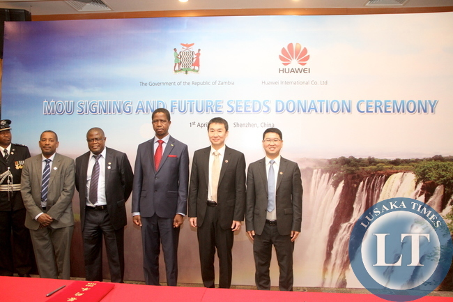 President Edgar Lungu , Huawei Senior Vice-President Dafeng Li (second from left) , Huawei Zambia managing director Fan Wen ( r) Minister of Energy Christopher Yaluma and Victor Mudenda after the signing ceremony between Huawei and Government of Zambia at Shenzhen Wuzhou Guest House on April 1,2015 -Picture by THOMAS NSAMA
