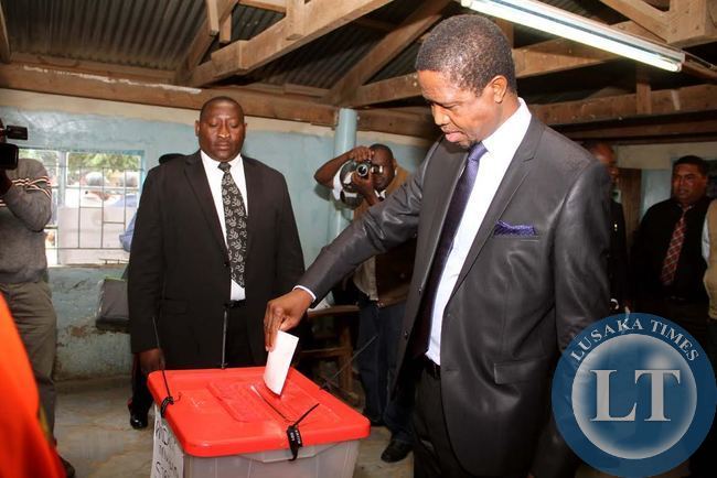 President Edgar Chagwa Lungu casts his voting at Andrew Mwenya Polling Station in Lusaka's John Howard Township on April 15,2015. PF's Lawrence Sichalwe and UPND's Charles Kaselwa are Hoping to succeed President Lungu in an array that has also attracted National Revolution Party president Cozmo Mumba's wife , Martha, UNIP's Bywell Kaluba and 4th Revolution Party's Benson Silwimba -Picture by THOMAS NSAMA