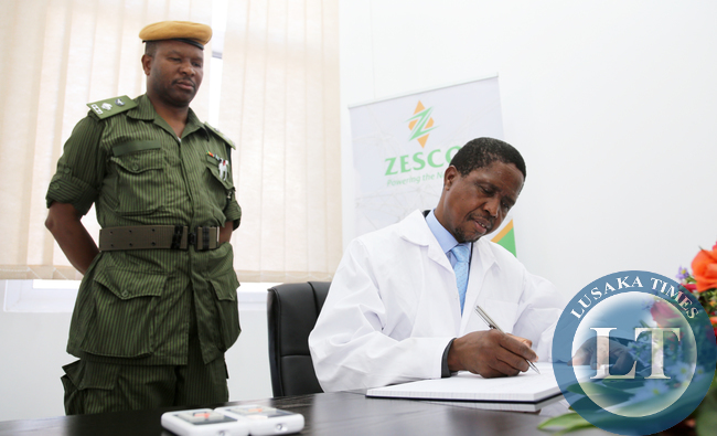 President Lungu Signs Visitors Book at Lunzua Power Plant