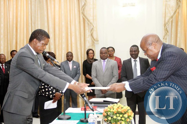 President Edgar Lungu receives an affidavit of Oath from Newly appointed Southern Province Permanent Secretary Sibanze Simuchoba during the Swearing-In-Ceremony at State House on April 22,2015 -Picture by THOMAS NSAMA