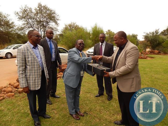 FOREIGN Affairs Deputy Minister, Mr. Rayford Mbulu, receives a gift from South Africa's Department of International Relations and Cooperation Protocol Officer, Mr. Christian Maluleka (R). Looking on are Zambia’s High Commissioner to South Africa, His Excellency Mr. Muyeba Chikonde (L); First Secretary in charge of Economic and Trade at the Zambian High Commission in South Africa, Mr. Mande Kauseni (2nd left); Assistant Director in charge of Development Cooperation at the Ministry of Foreign Affairs, Mr. Sylvester Mundanda (2nd right).