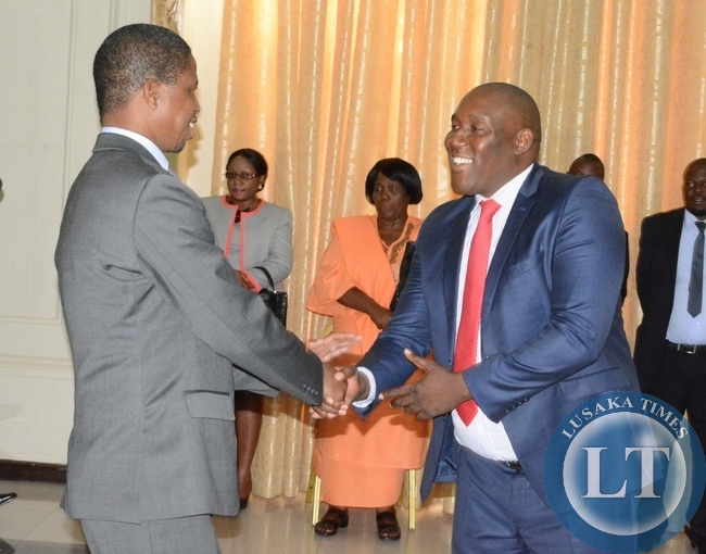 President Edgar Lungu congratulates His special assistant for legal Affairs Sukwana Lukaangaba shortly after swearing in ceremony at State House
