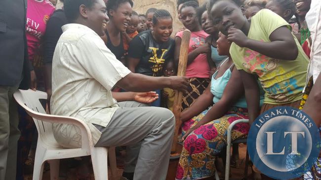 UPND President Hakainde Hichilema interacts with residents in Linda compound