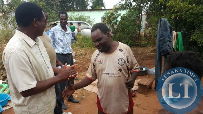 UPND President Hakainde Hichilema interacts with residents in Linda compound