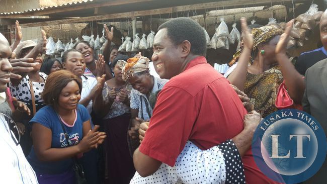 UPND president Hakainde Hichilema interacts with residents in Bauleni compound