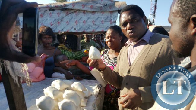 UPND president Hakainde Hichilema interacts with marketeers in Marapodi township