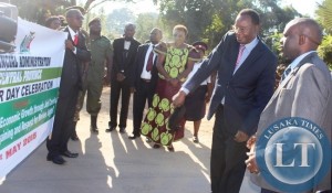 Health Minister Dr Joseph Kasonde (second right) flagging off this year's International Labour day celebrations in Kabwe today. Looking on (centre ) is Central Province Permanent Secretary Edwidge Mutale and Kabwe DC Patrick Chishala on the right.