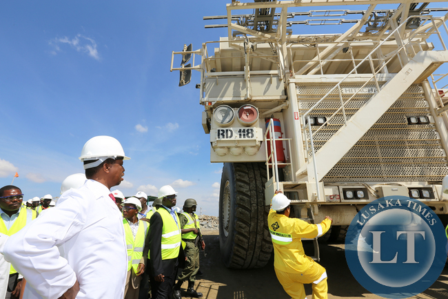 President Edgar Lungu during the Tour of Kansanshi Mine PLC in Solwezi on Friday watches Female Grace Katambi Mine Truck driver 168tonnes 15-05-2015 Picture EDDIE MWANALEZA /STATE HOUSE.