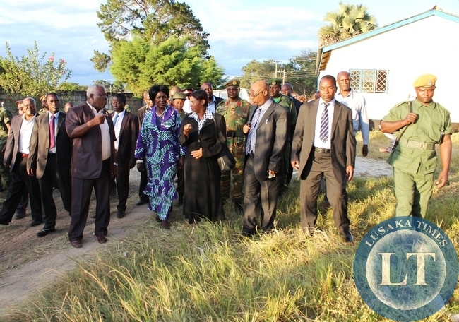 Vice president Inonge Wina visits Amos Chilufya 6,at the Childrten,s Ward at Kasama General Hospital today. Looking on is Northern Province Minister Freedom Sikazwe.The Vice President who is on a four day tour of developmental projects in the Province donated various items to the children wing