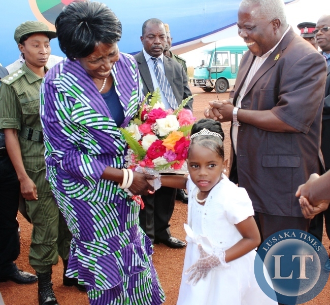 Vice president Inonge Wina being welcomed by Nkusechela Sinkamba upon arrival at Kasama airport today. Looking on is Northern Province Minister Freedom Sikazwe.The Vice President is on a four day tour of developmental projects in the Province