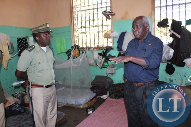 Home Affairs Deputy Minister Panji Kaunda (right) talks to Livingstone Central Prison assistant superintendent and deputy office in charge Ivor Musumali (left) inside Livingstone Central Prison on