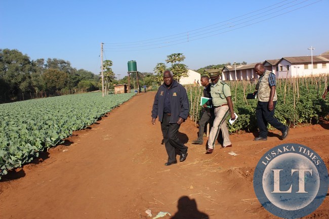 Home Affairs Deputy Minister Panji Kaunda (left) leading a delegation in inspecting vegetables at Livingstone Central Prison on Monday