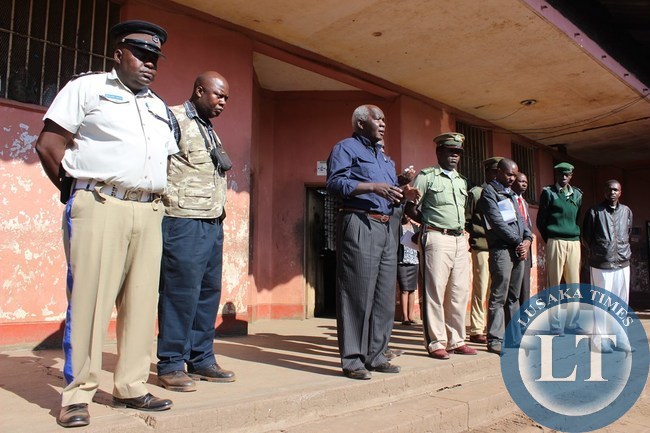 Home Affairs Deputy Minister Panji Kaunda (third from the far left) addressing prisoners (not in picture) at Livingstone Central Prison on Monday
