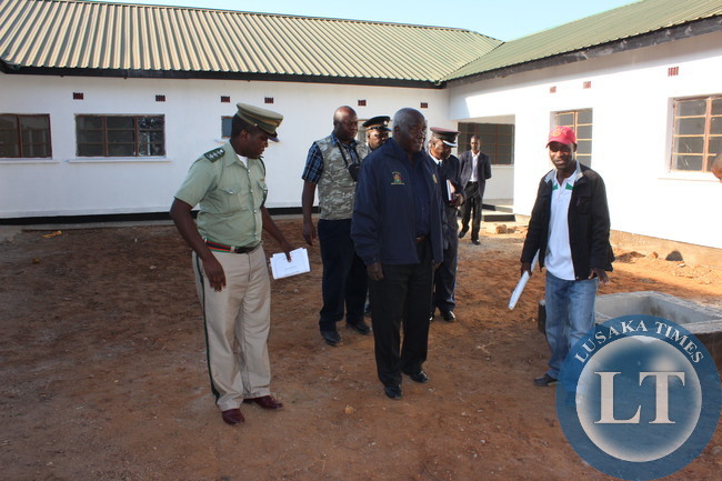 Home Affairs Deputy Minister Panji Kaunda inspecting one of the police houses at Livingstone Police Camp