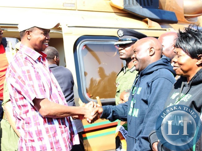 PRESIDENT Edgar Lungu is received by PF Campaign Manager, Stephen Kampyongo, at Petauke Day Secondary school