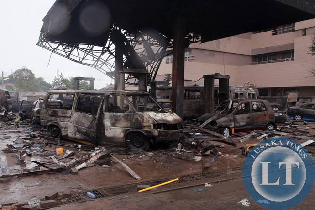 Flooding in Ghana's capital swept stored fuel into a nearby fire, setting off a huge explosion at a gas station, authorities said Thursday. PHOTO: CHRISTIAN THOMPSON/ASSOCIATED PRESS