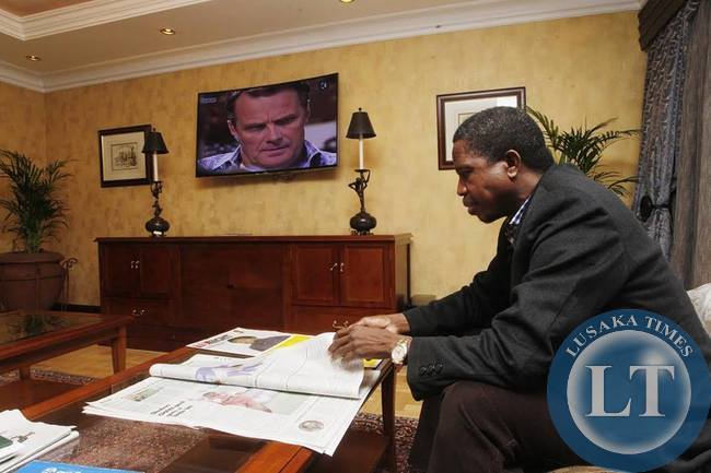 His Excellency Mr. Edgar Chagwa Lungu President of the Republic of Zambia reads the Pretoria Newspaper at Sheraton Hotel on Monday, June 22,2015. PICTURE BY SALIM HENRY/STATE HOUSE © 2015