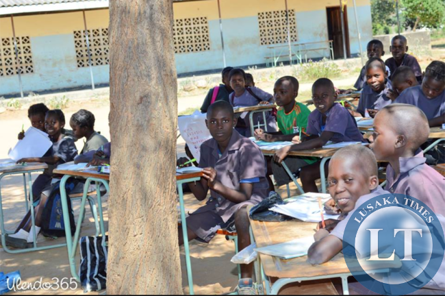 Children learning under a tree at Sialwala Primary School located in Sinazongwe,due to lack of classrooms.