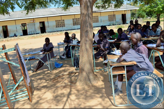 Children learning under a tree at Sialwala Primary School located in Sinazongwe,due to lack of classrooms.